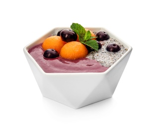 Photo of Bowl with tasty acai smoothie on white background