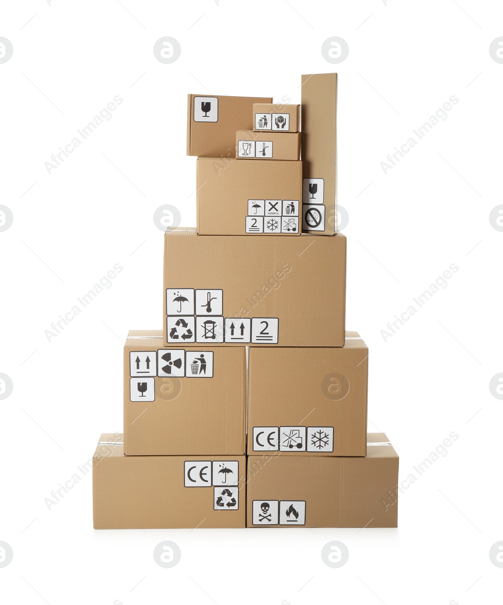 Photo of Stack of cardboard boxes with different packaging symbols on white background. Parcel delivery