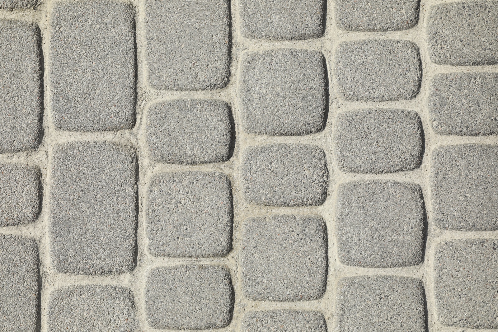 Photo of Pavement with grey tiles as background, top view