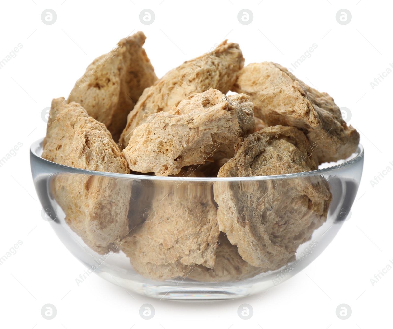 Photo of Dehydrated soy meat chunks in bowl on white background