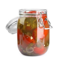 Pickled tomatoes in glass jar on white background