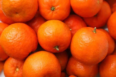 Photo of Many fresh tangerines as background, top view