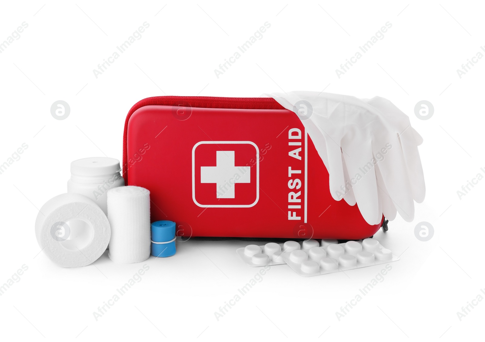 Photo of First aid kit, gloves, pills and elastic bandage on white background. Health care