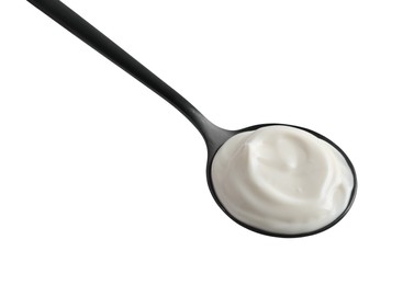 Photo of One black spoon with mayonnaise isolated on white
