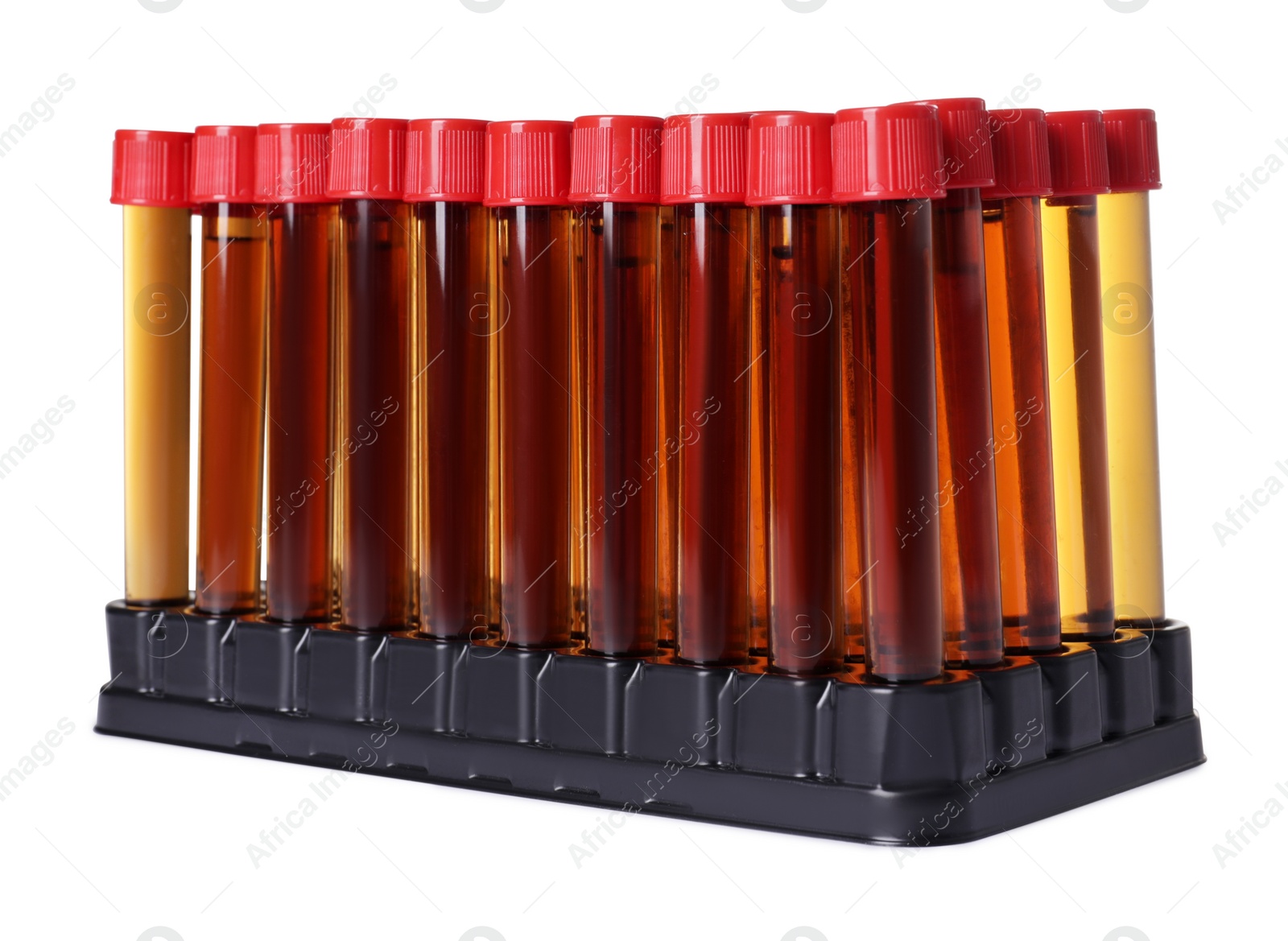 Photo of Test tubes with brown liquid in stand on white background