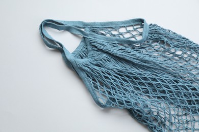 Photo of Blue string bag on light grey background, top view