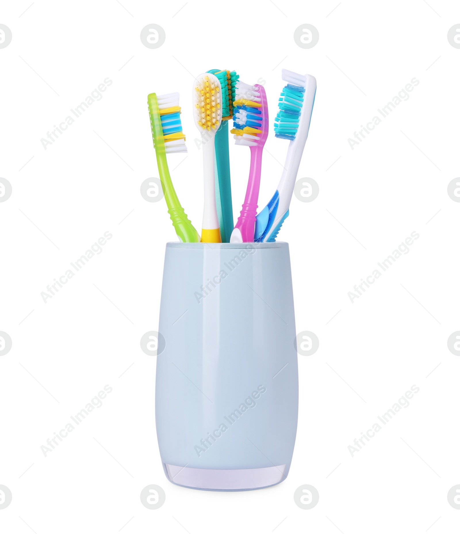 Photo of Different toothbrushes in holder isolated on white