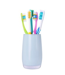 Photo of Different toothbrushes in holder isolated on white