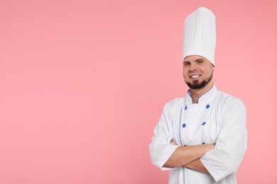 Happy professional confectioner in uniform on pink background. Space for text