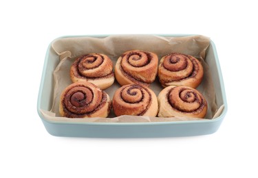 Photo of Baking dish with tasty cinnamon rolls isolated on white