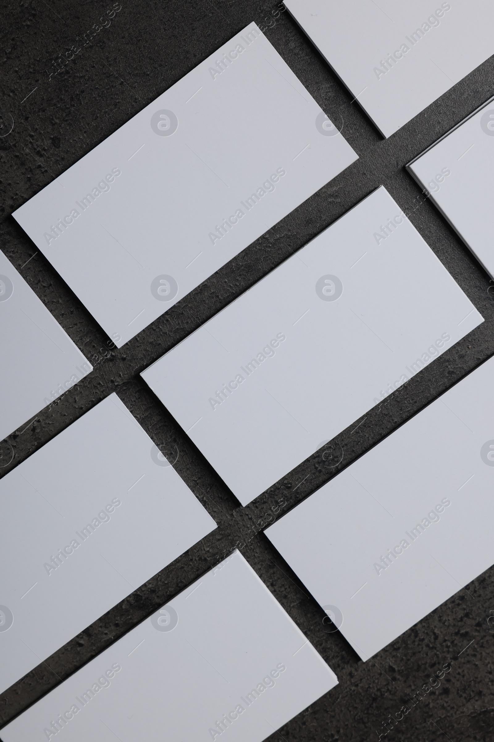 Photo of Blank business cards on grey textured background, top view. Mockup for design