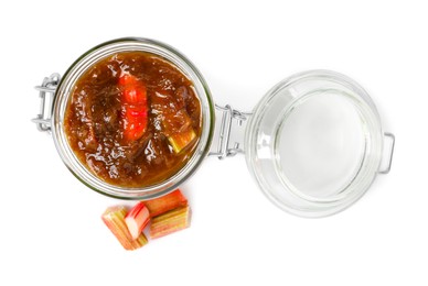 Jar of tasty rhubarb jam and cut stems on white background, top view