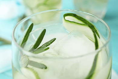 Photo of Glass of refreshing cucumber lemonade on table, closeup. Summer drink