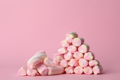 Photo of Stack of tasty marshmallows on pink background