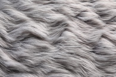 Texture of grey faux fur as background, closeup