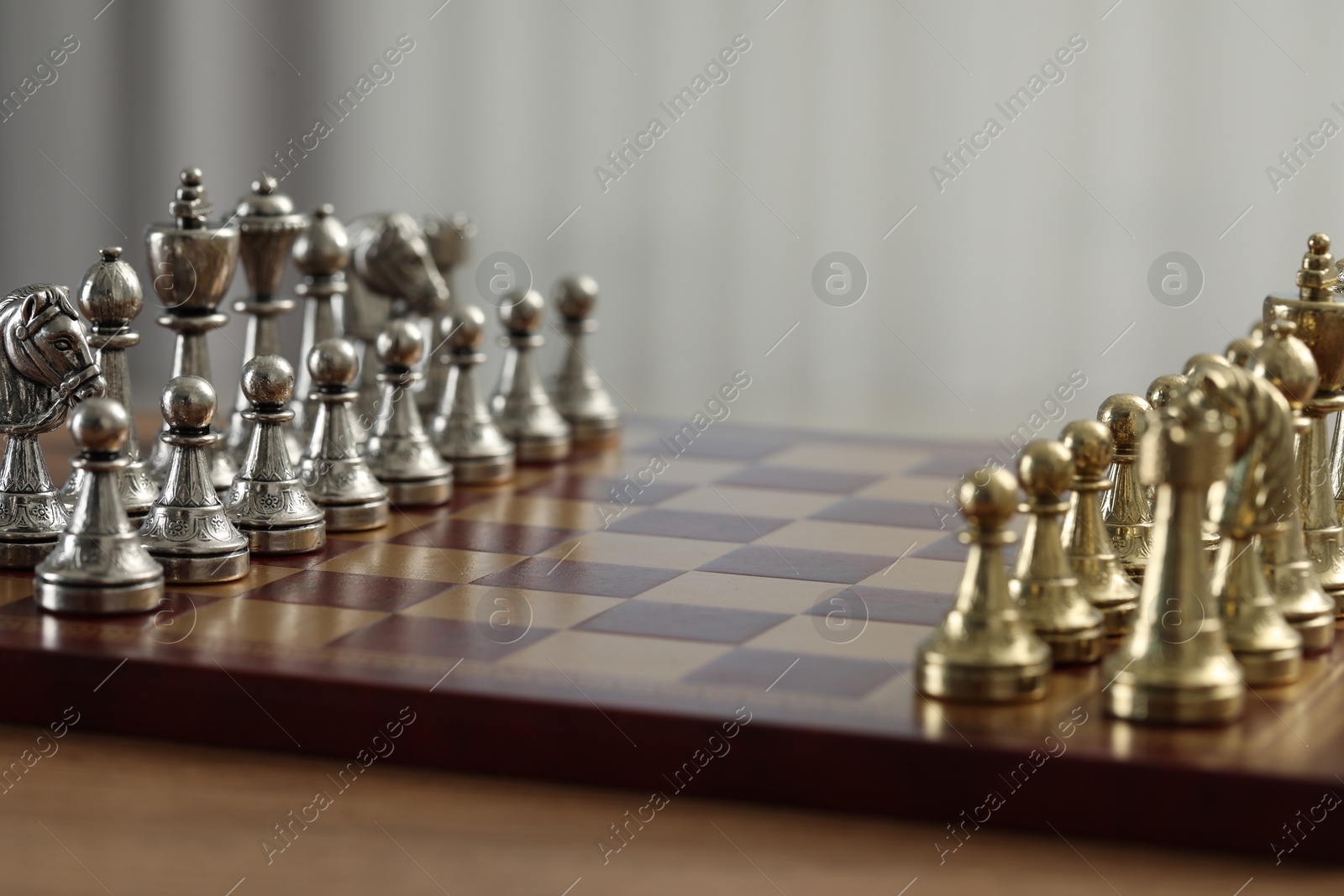 Photo of Set of chess pieces on checkerboard before game, selective focus. Space for text