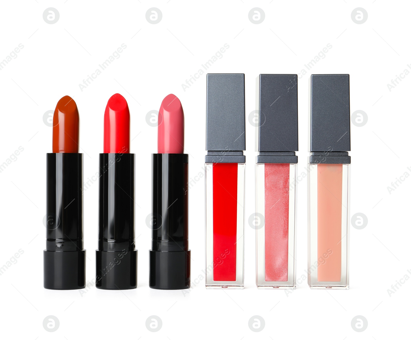 Photo of Different lipsticks on white background. Cosmetic product