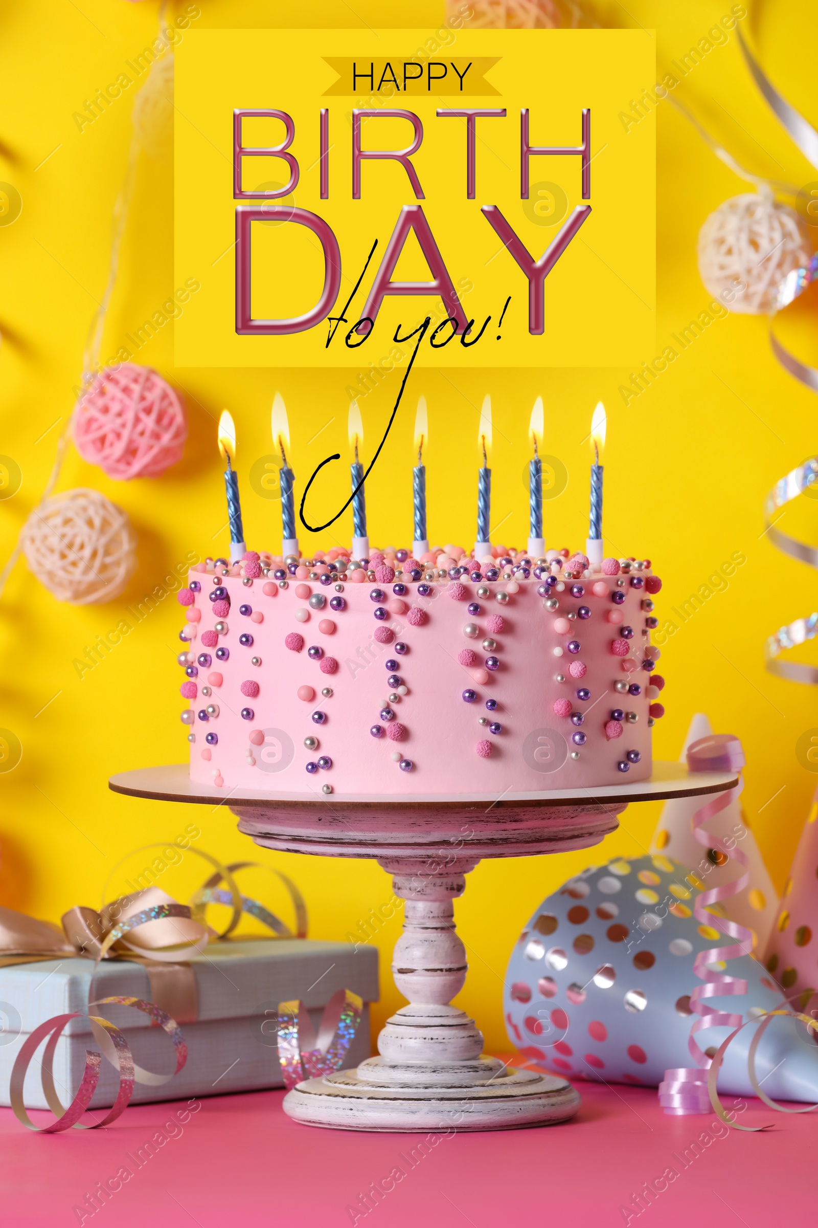 Image of Happy Birthday! Delicious cake and party decor on pink table against yellow background