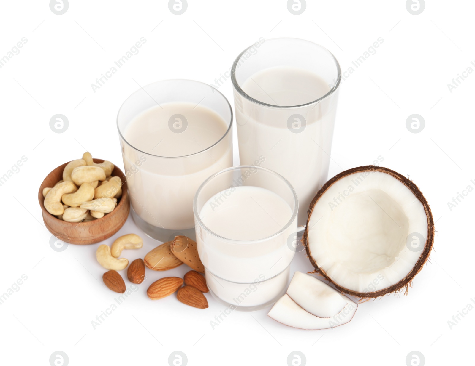 Photo of Vegan milk and different nuts on white background