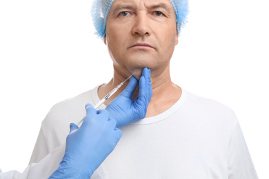 Photo of Mature man with double chin receiving injection on white background