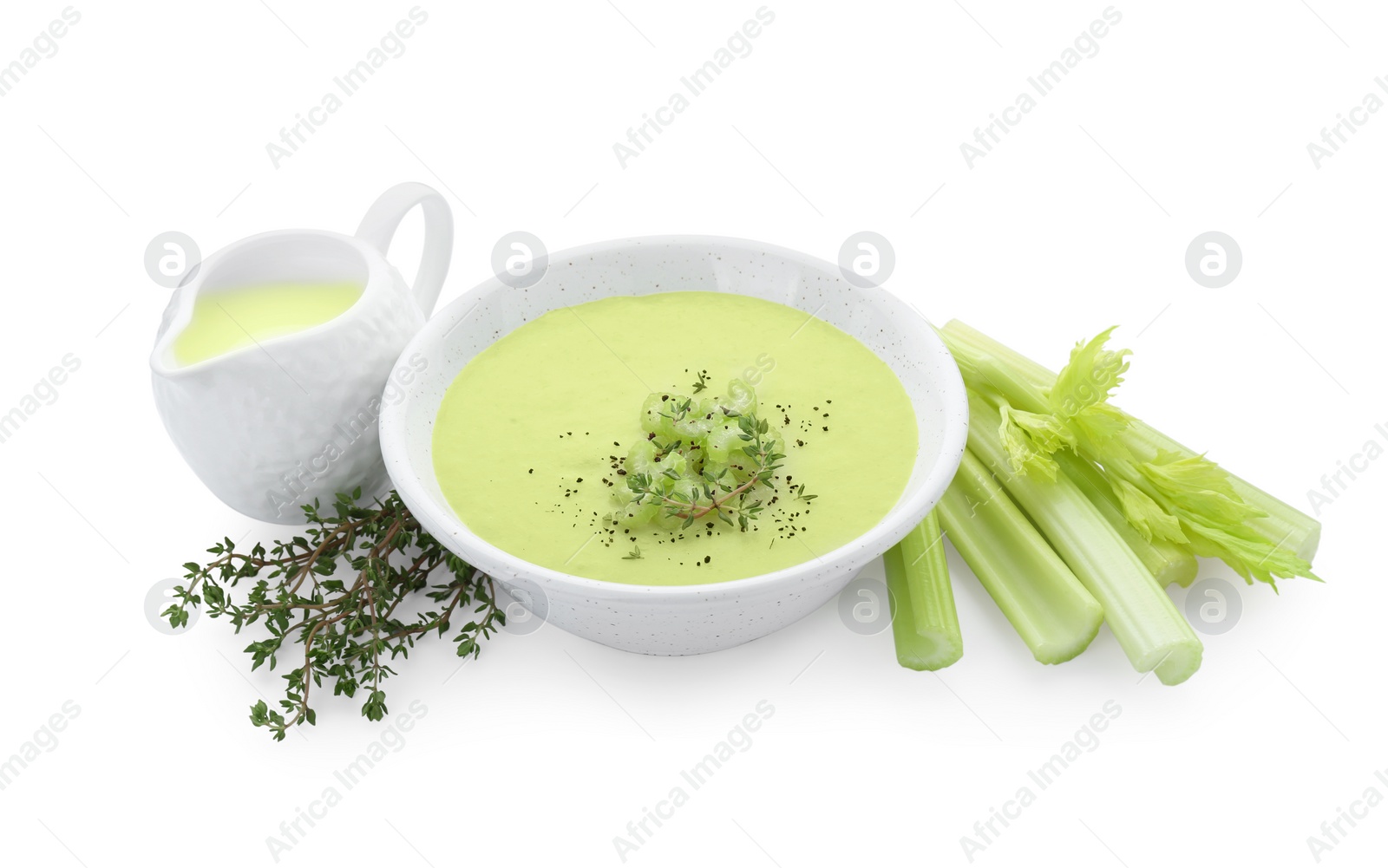 Photo of Bowl of delicious celery soup and ingredients isolated on white