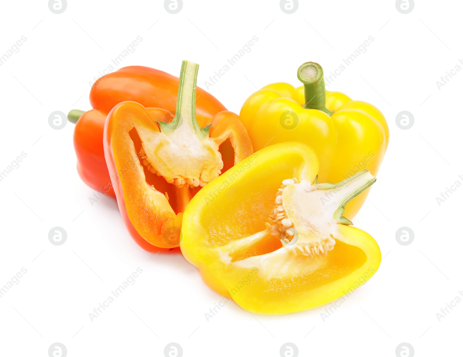 Photo of Whole and cut bell peppers on white background