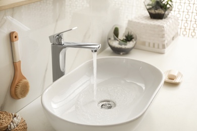 Photo of Stylish white sink in modern bathroom interior