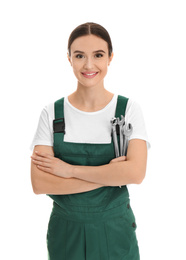 Portrait of professional auto mechanic with wrenches on white background