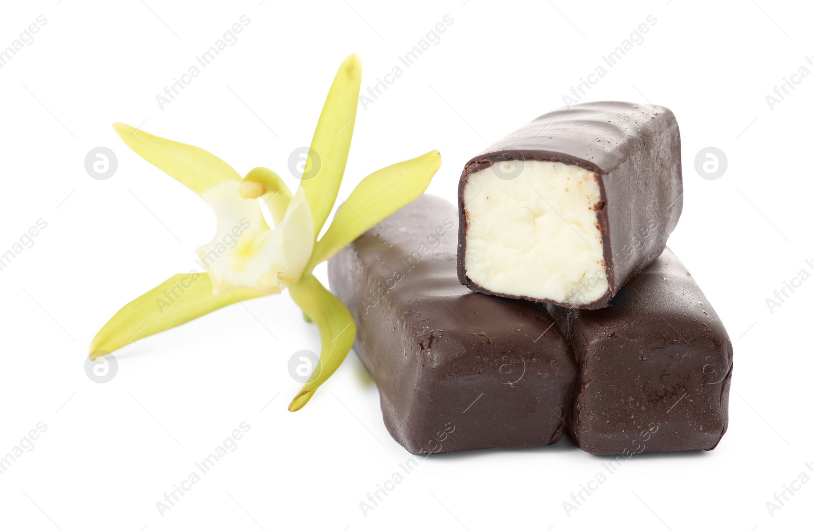 Photo of Glazed curd cheese bars and vanilla flower isolated on white