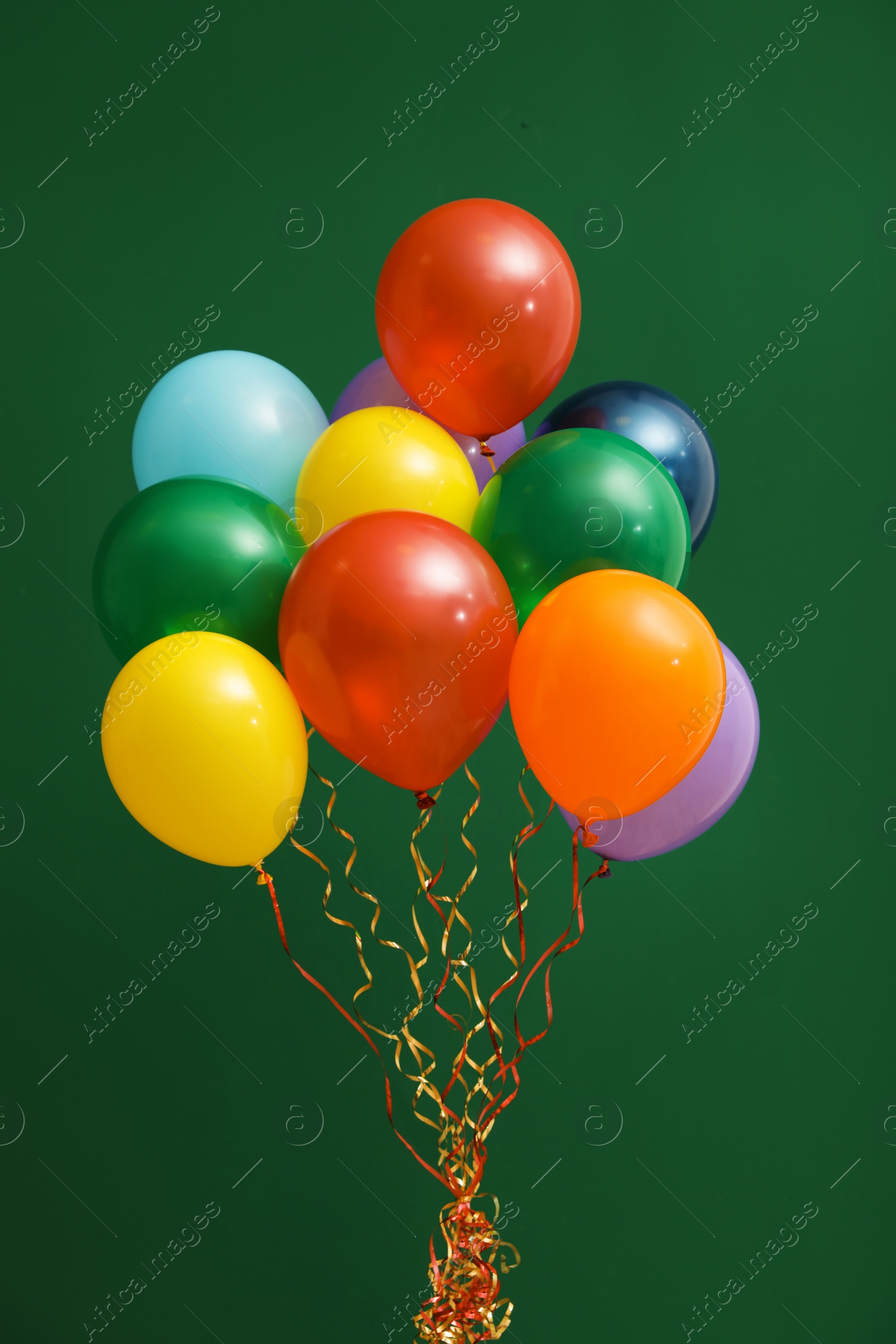 Photo of Bunch of bright balloons on color background. Celebration time