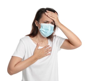 Photo of Mature woman with protective mask suffering from breathing problem on white background