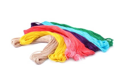 Photo of Set of colorful embroidery threads on white background