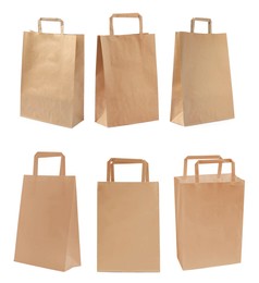 Image of Set with kraft paper bags on white background