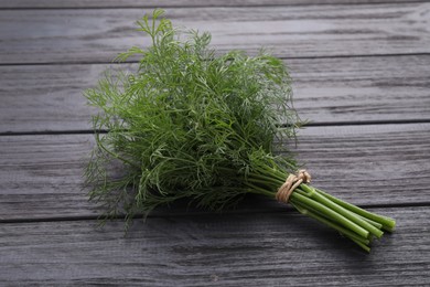 Bunch of fresh dill on wooden table