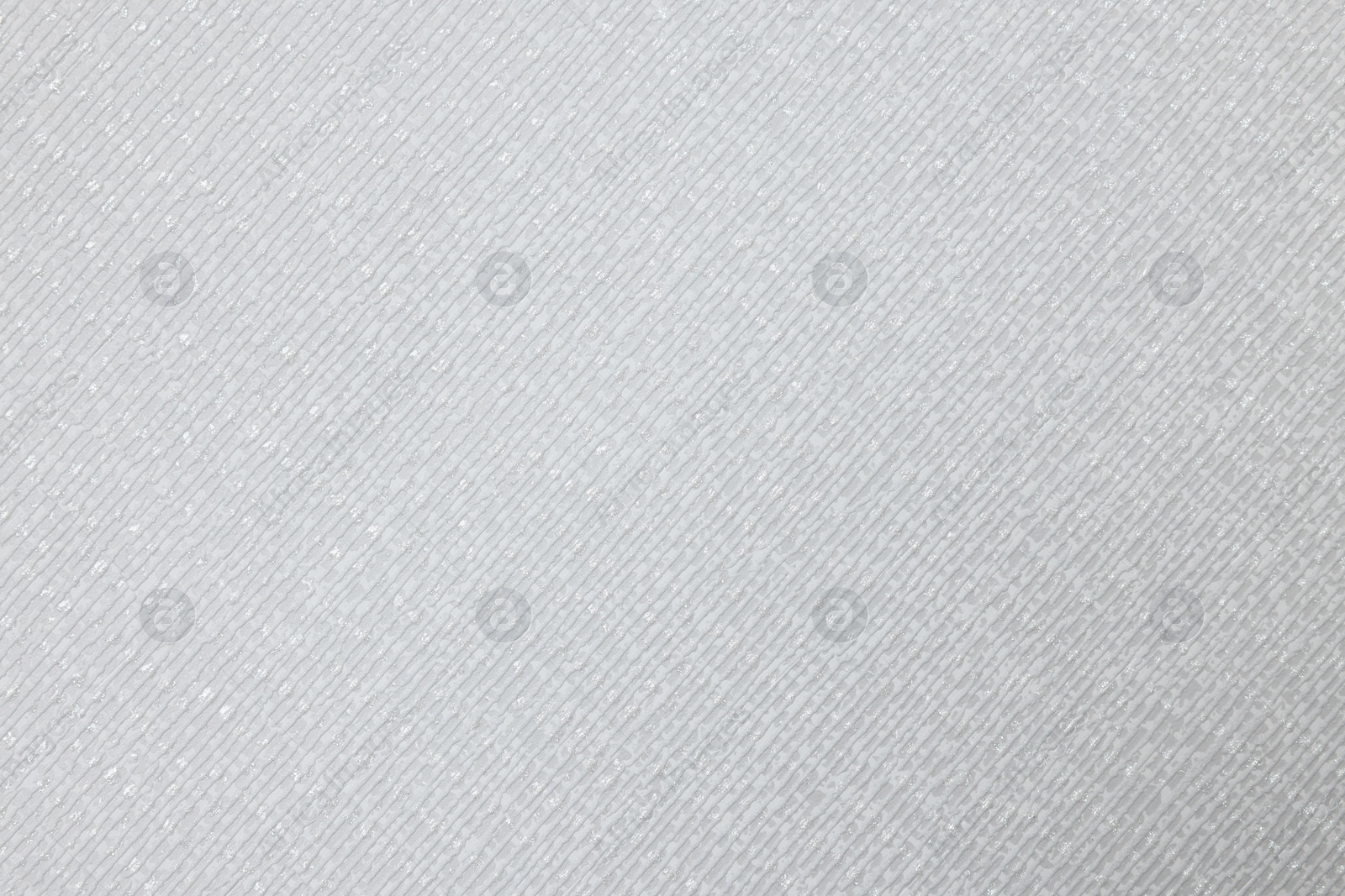 Photo of Stylish light grey wallpaper as background, closeup view