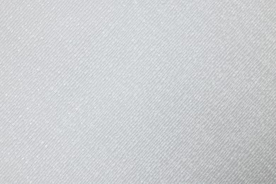 Photo of Stylish light grey wallpaper as background, closeup view