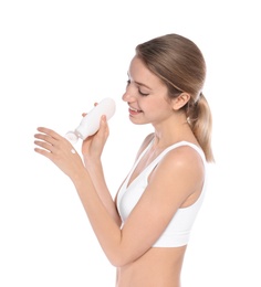 Photo of Young woman applying hand cream on white background. Beauty and body care