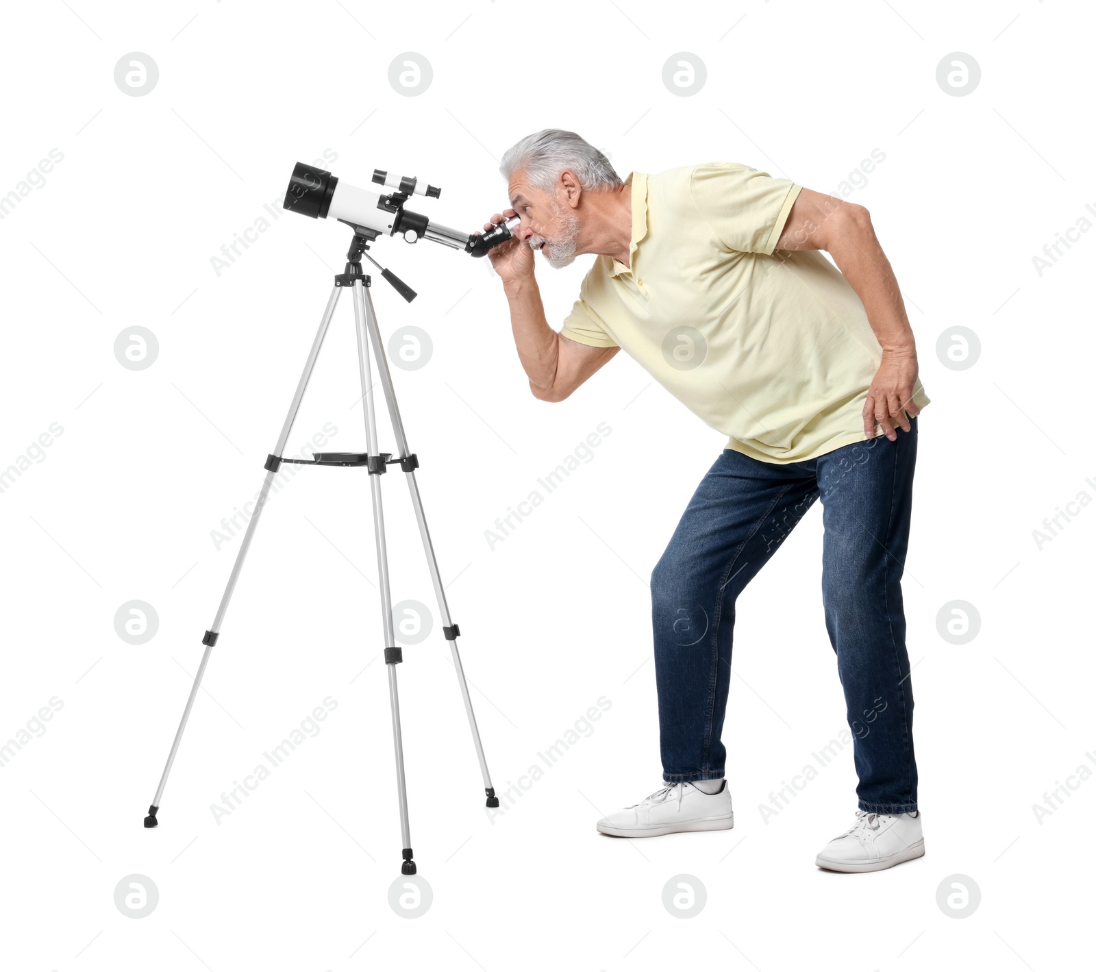 Photo of Senior astronomer looking at stars through telescope on white background