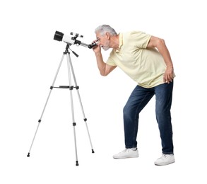 Senior astronomer looking at stars through telescope on white background