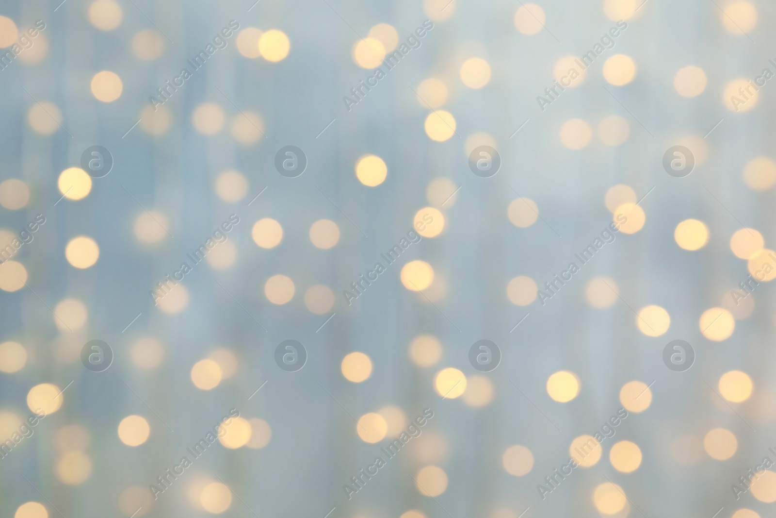 Photo of Blurred view of glowing Christmas lights as background