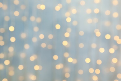 Photo of Blurred view of glowing Christmas lights as background