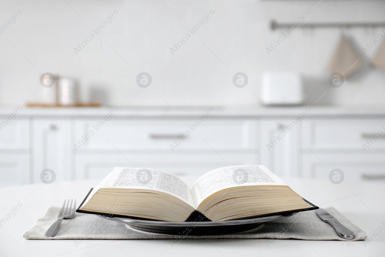 Photo of Table setting with Holy Bible on white background. Great Lent season