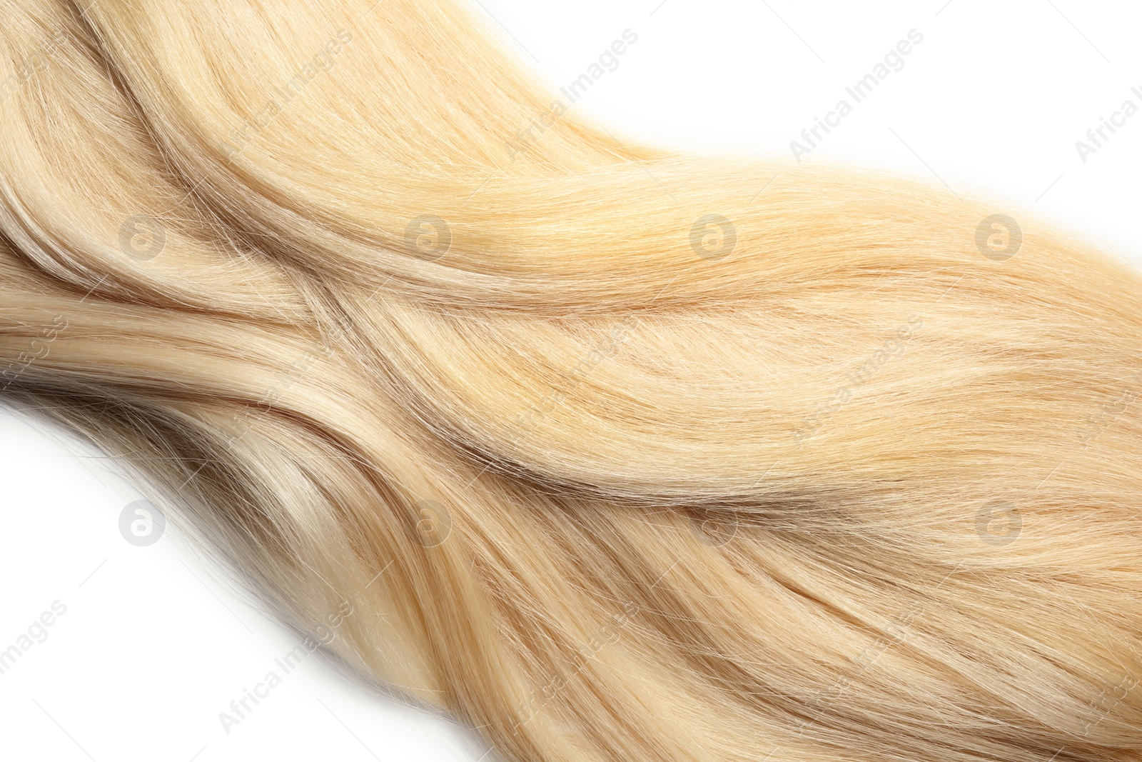 Photo of Strand of healthy blond hair on white background