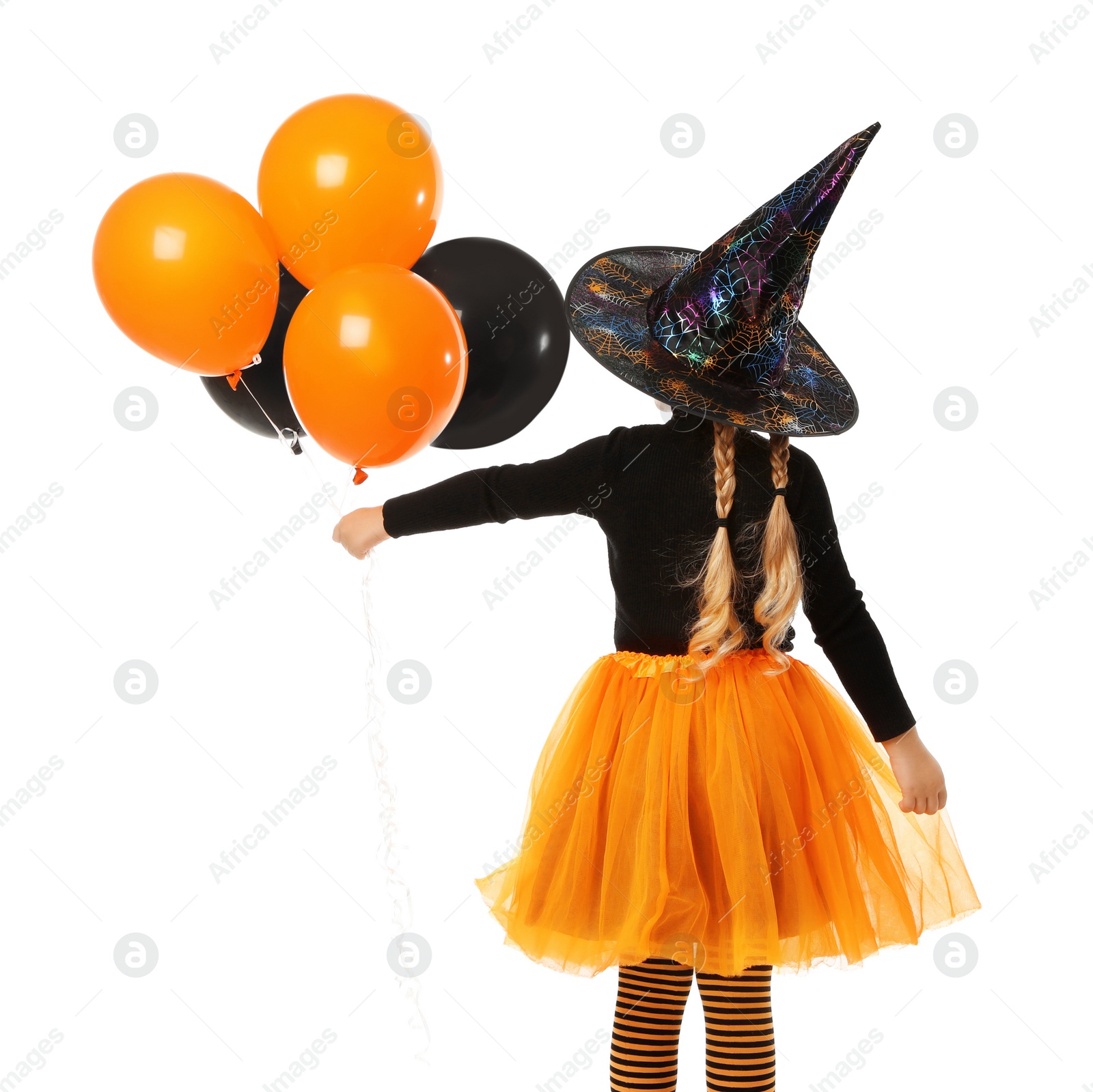 Photo of Cute little girl with balloons wearing Halloween costume on white background