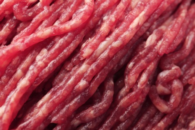 Photo of Fresh raw minced meat as background, closeup