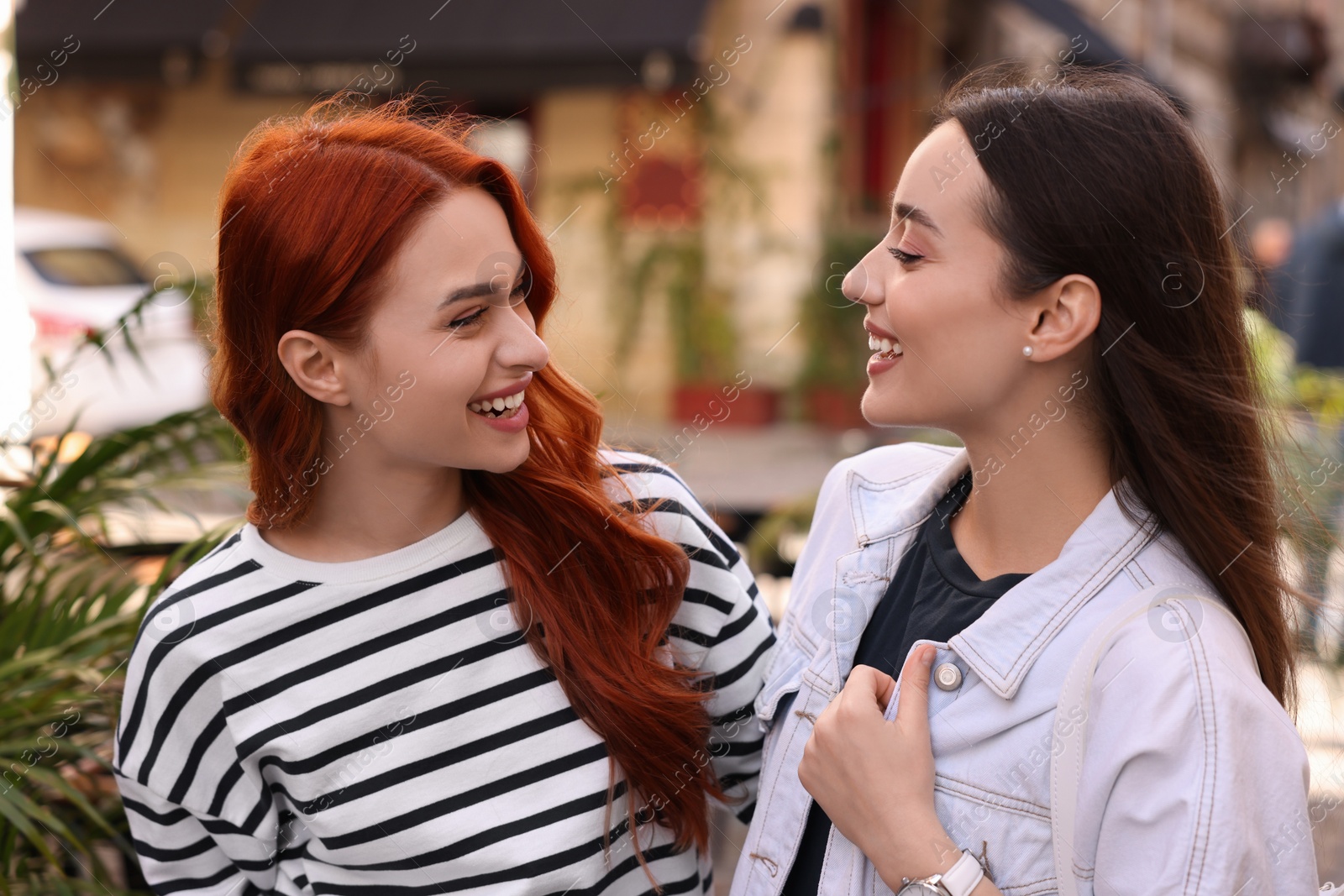 Photo of Portrait of happy friends spending time together outdoors