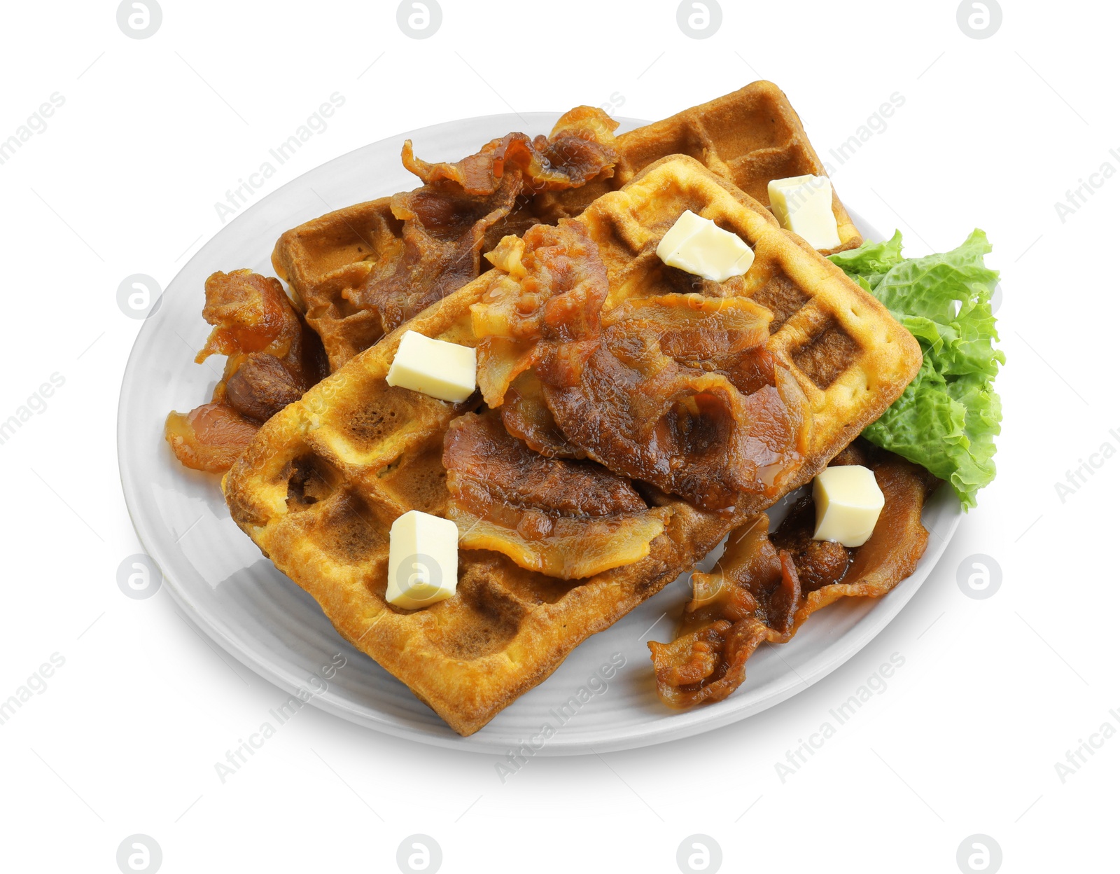 Photo of Delicious Belgium waffles served with fried bacon and butter isolated on white