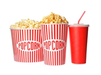 Delicious fresh popcorn and cup of beverage on white background