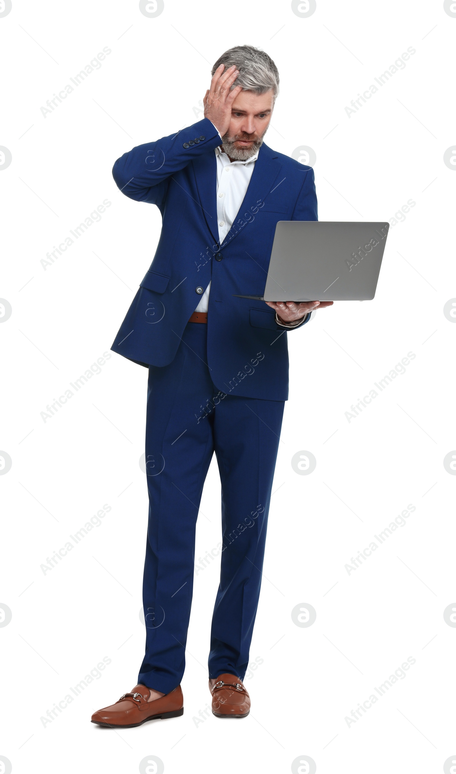 Photo of Mature businessman in stylish clothes with laptop on white background