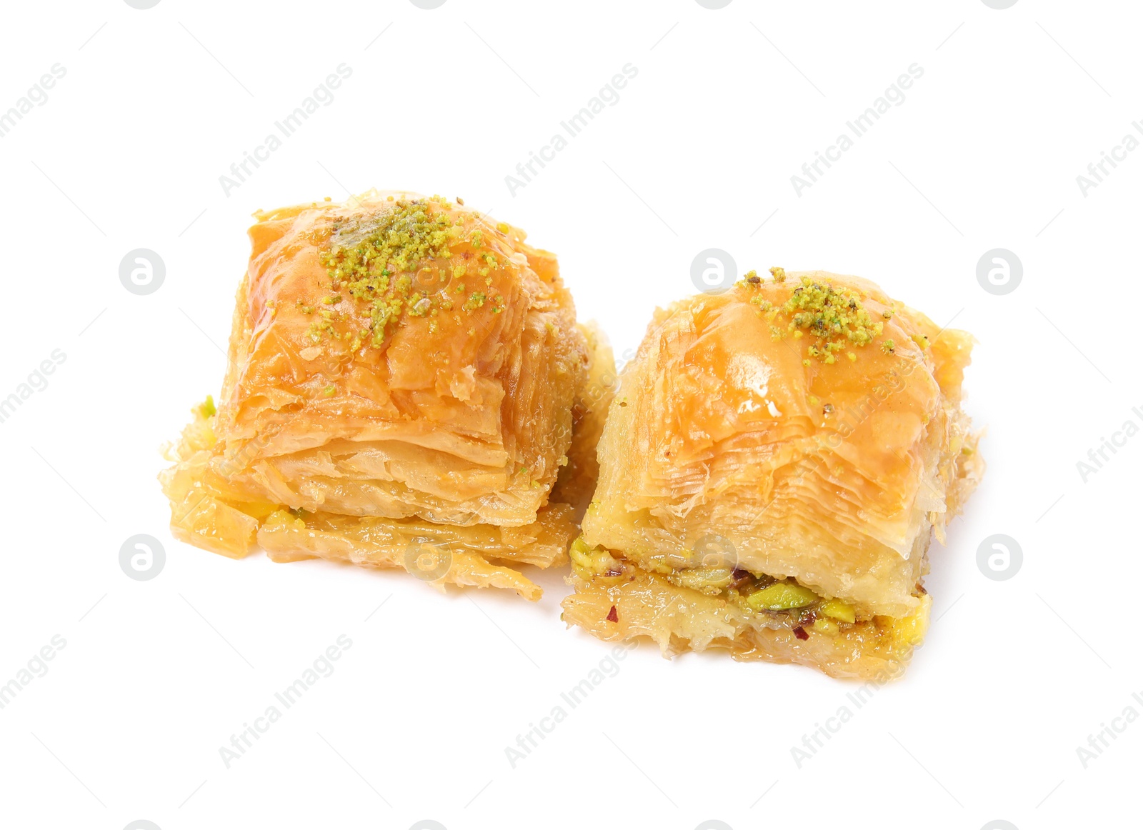 Photo of Delicious baklava with pistachios isolated on white